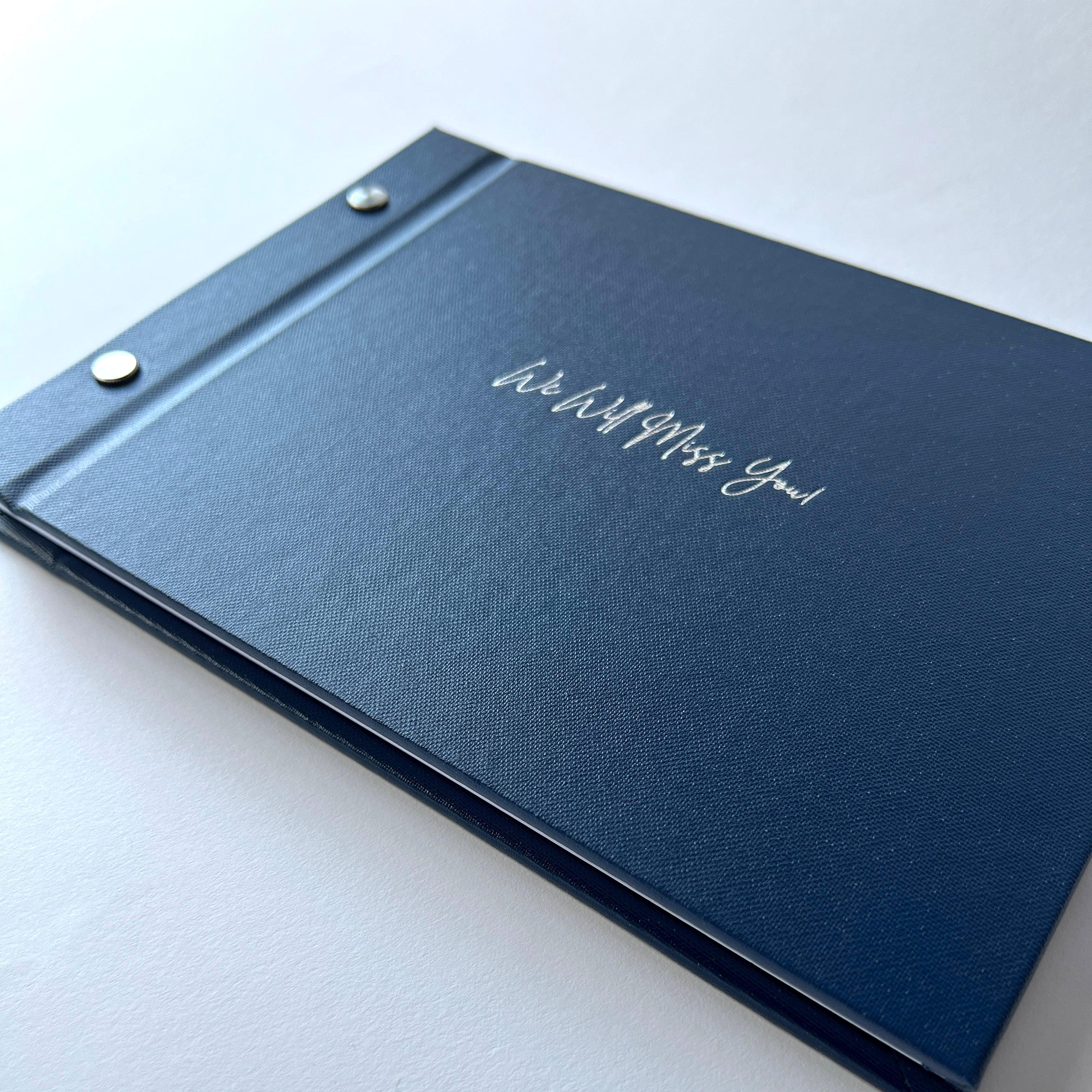 navy-blue-book-lay-flat-with-we-will-miss-you-in-silver-foil-on-cover