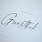 Guestbook cover with 'Please sign our guestbook' text on a light background
