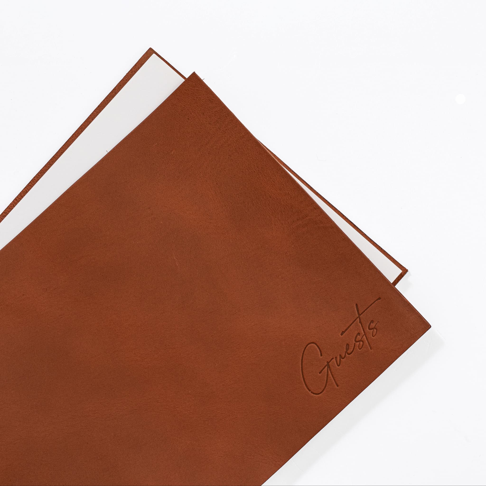 Close up of blind debossed Guests on leather cover