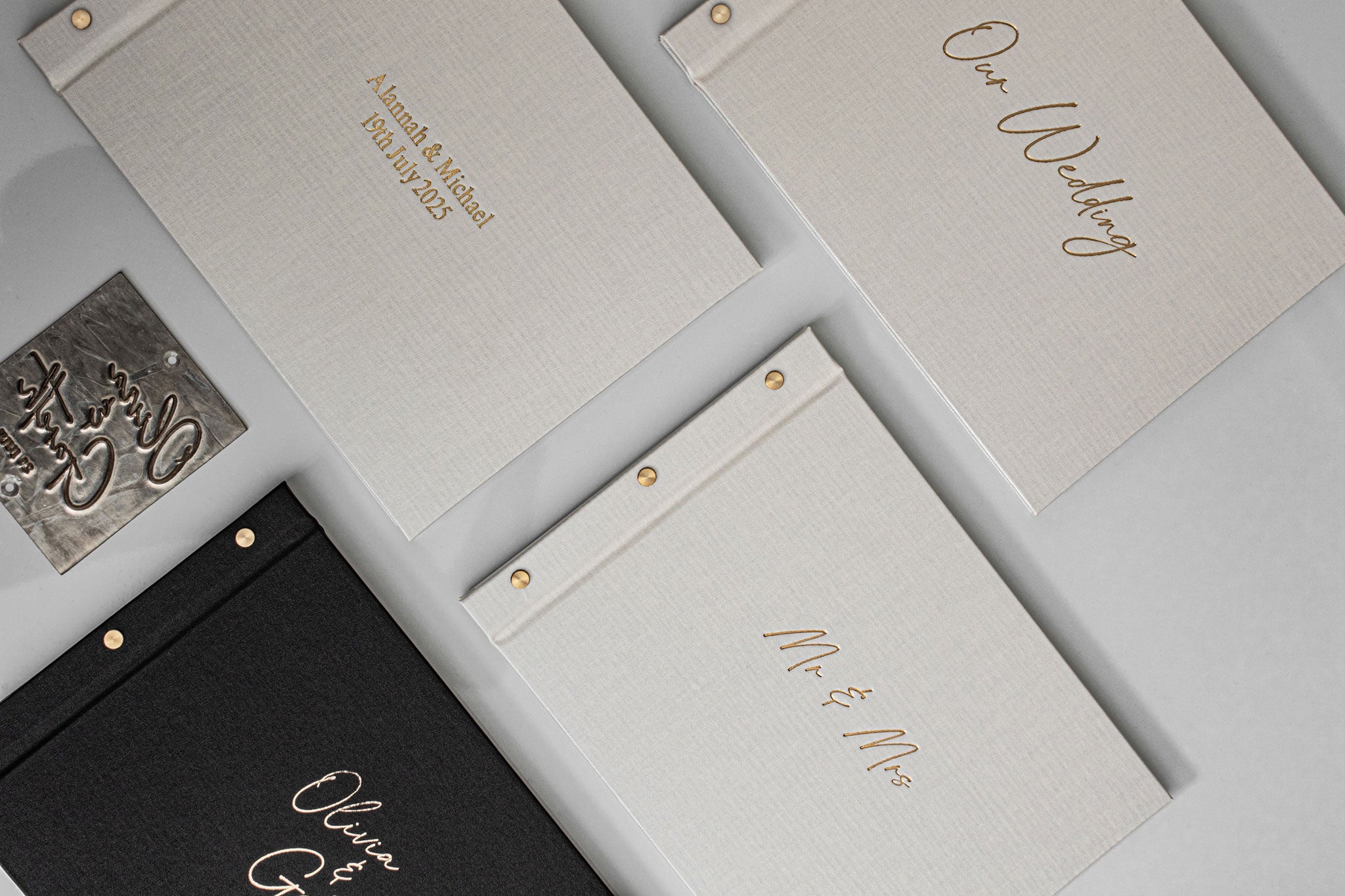 Wedding invitation set with gold text on gray and black backgrounds