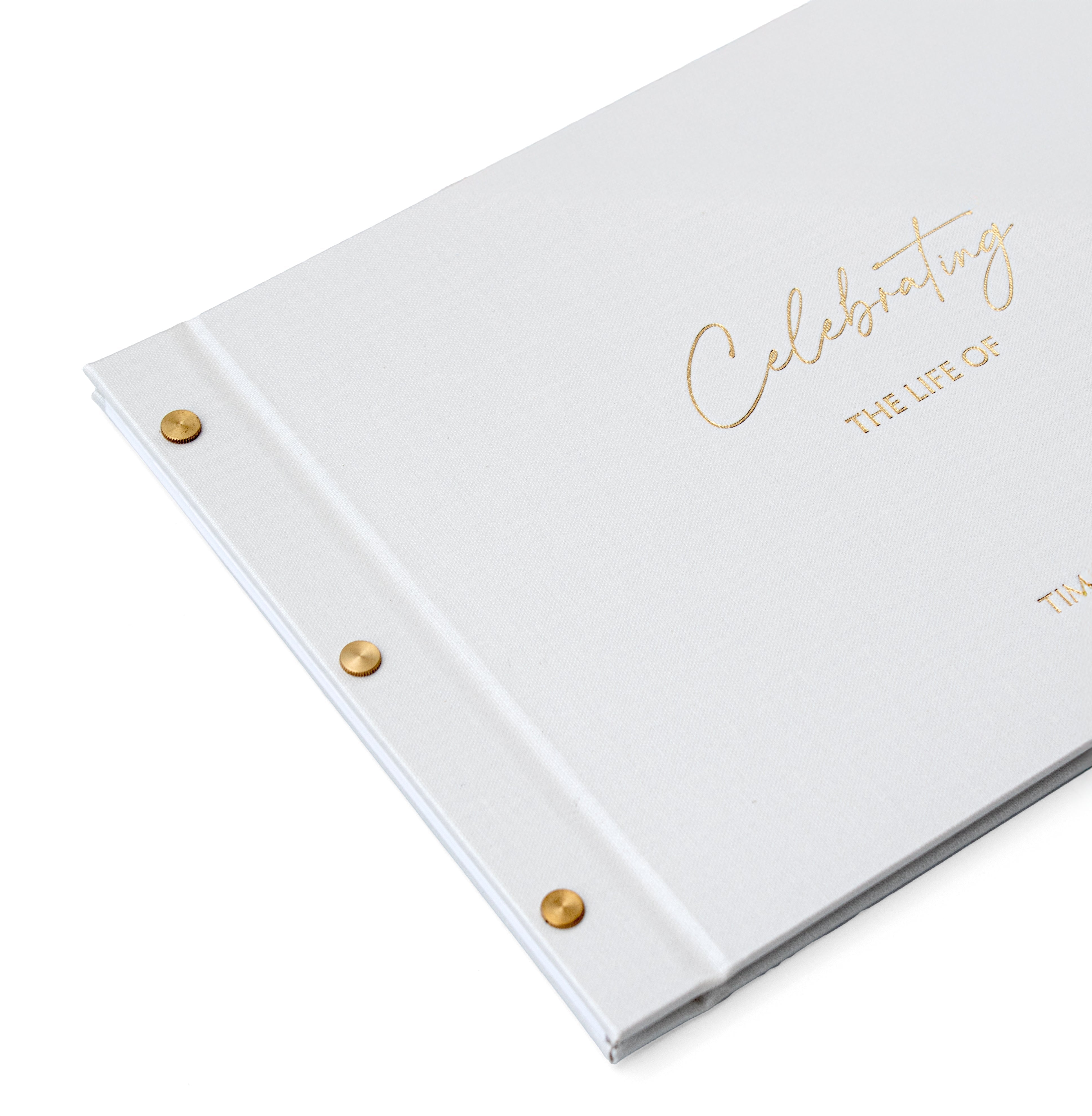 White condolence book with gold foil Celebrating the life of on the cover