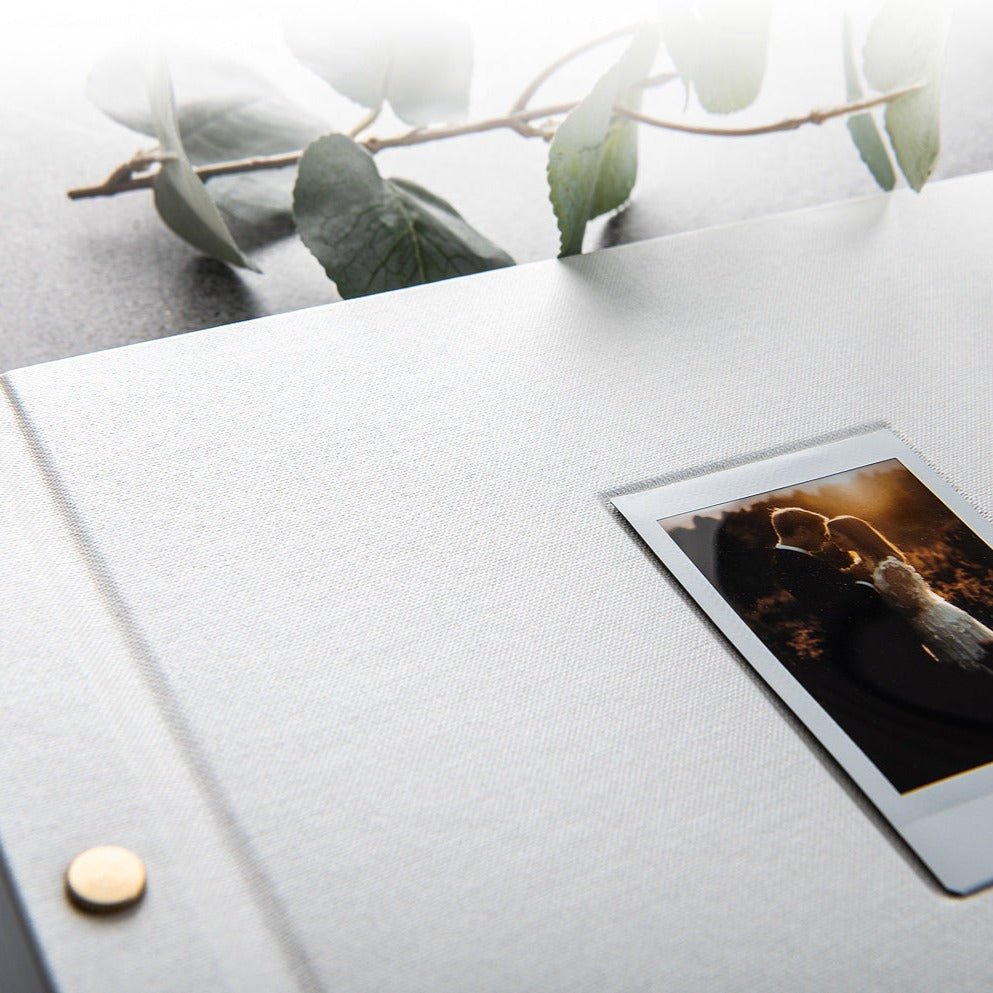 White wedding guestbook featuring an instax photo on the cover