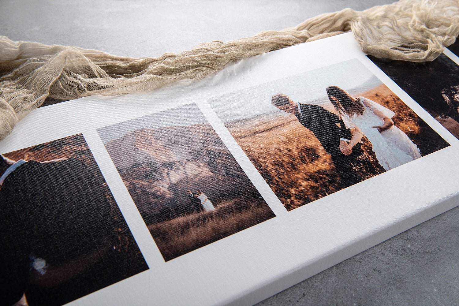 panoramic canvas print with wedding photos styled as flat lay with linen draped to the side