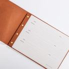 Open leather visitors book showing structured message pages