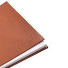 Close up of blind debossed Guests on leather cover