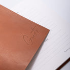 Italian leather visitors book cover with blind debossed Guests text