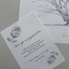 Fingerprint tree cards with floral designs on a gray surface