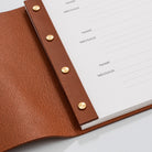 Post bound leather visitors book with brass fixings detail