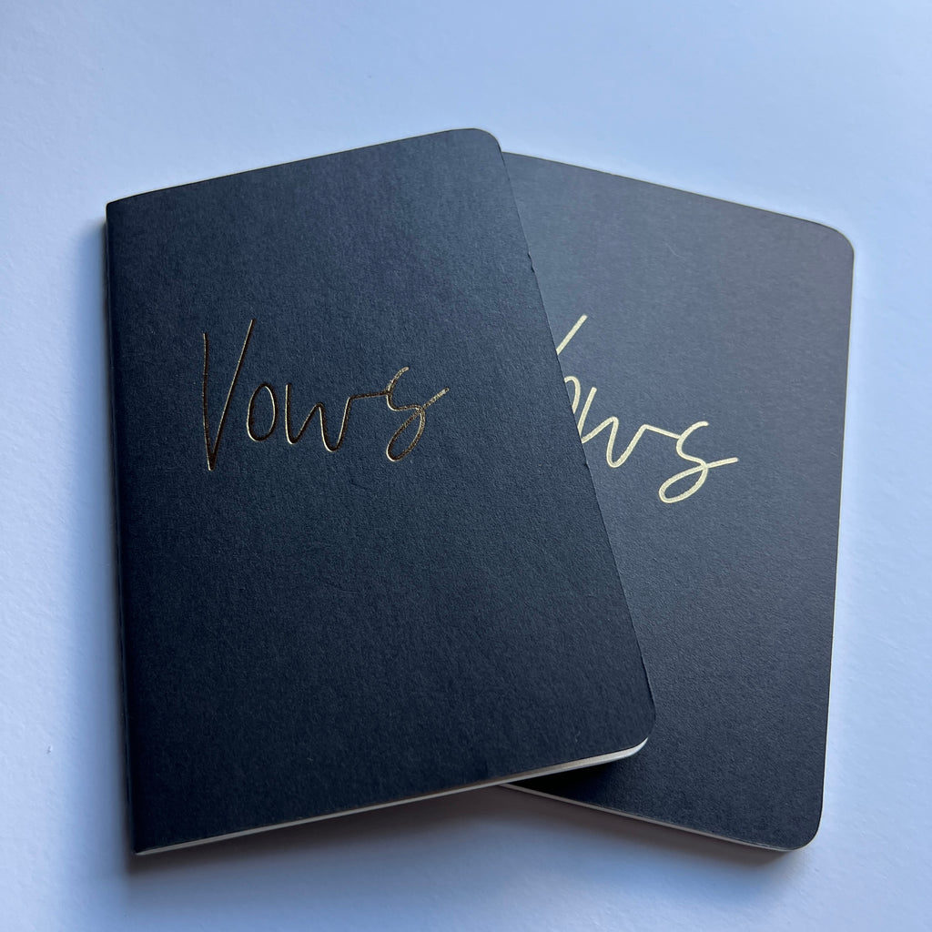 black vow books with gold foiled wording on the cover