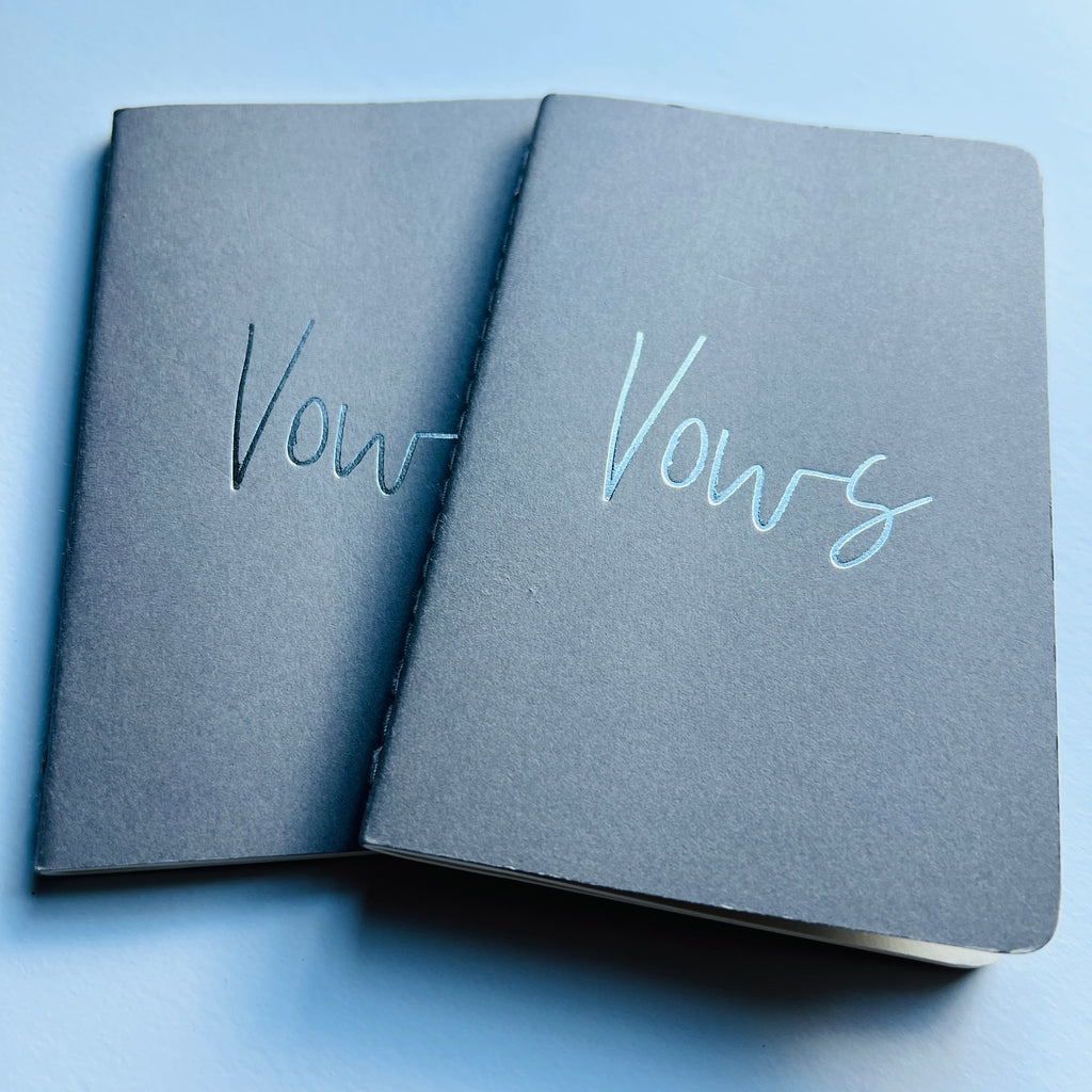 grey vow books with silver foiled writing on cover